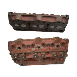 Головка блоку без клапанів з напрямними втулками